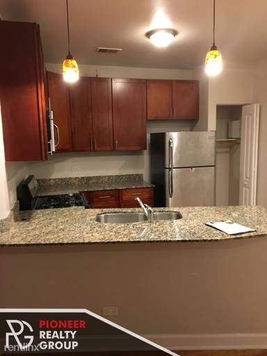 Main picture of 2038-48 W Touhy Ave & 7213-29 N Rogers Ave