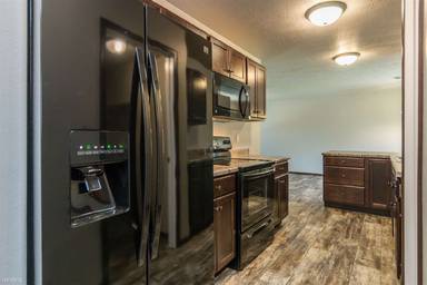 Main picture of South Woods Town Homes & Villas
