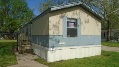 Main picture of The Woodlands Manufactured Home Community