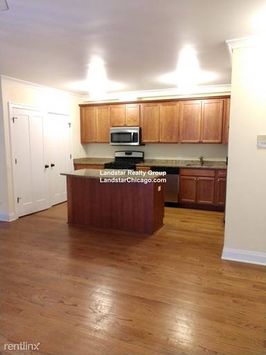 Main picture of 2702 W Ainslie St & 4906 N Washtenaw Ave Apartments